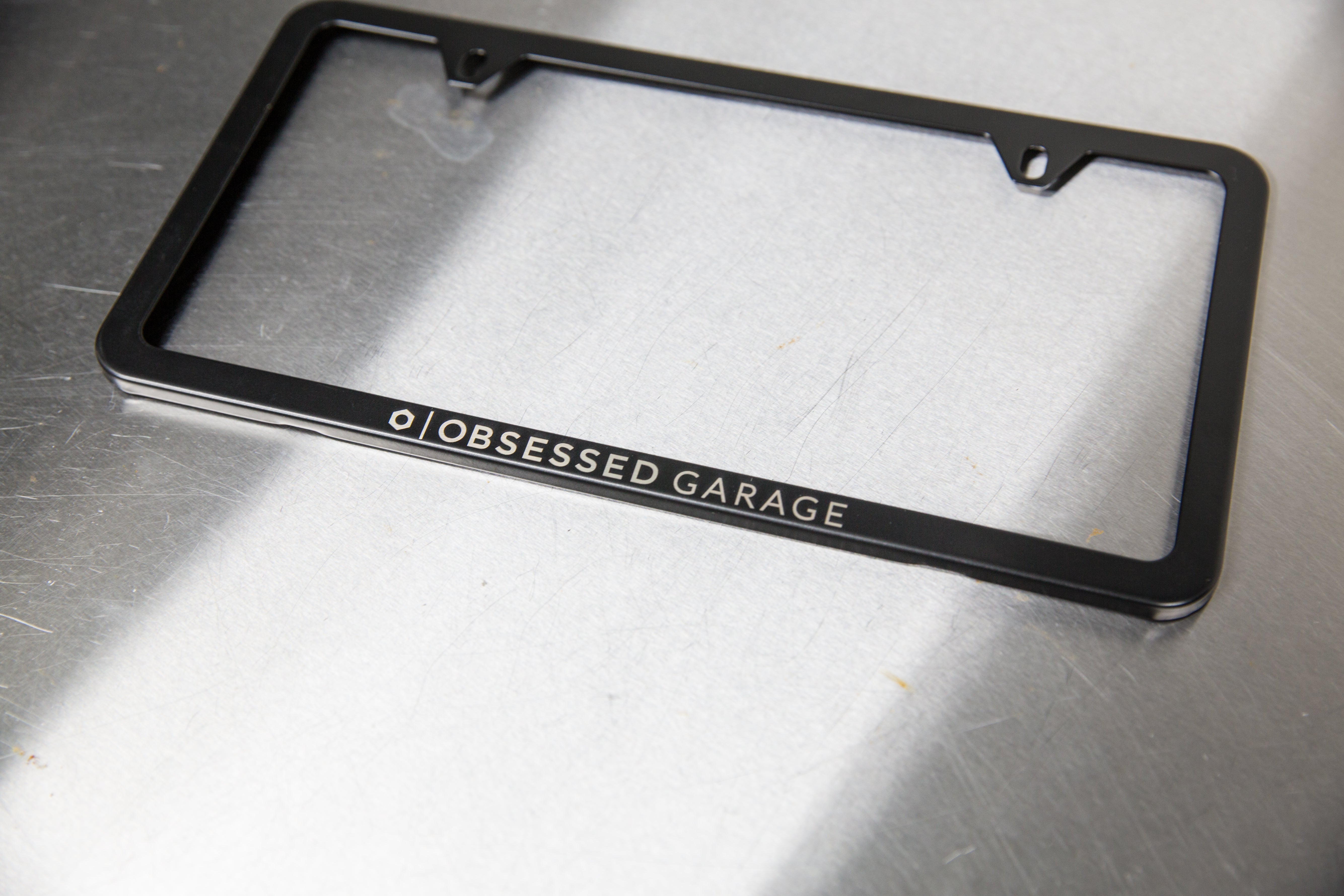Premium Slim Plate Frames in Brushed Stainless Steel and Black