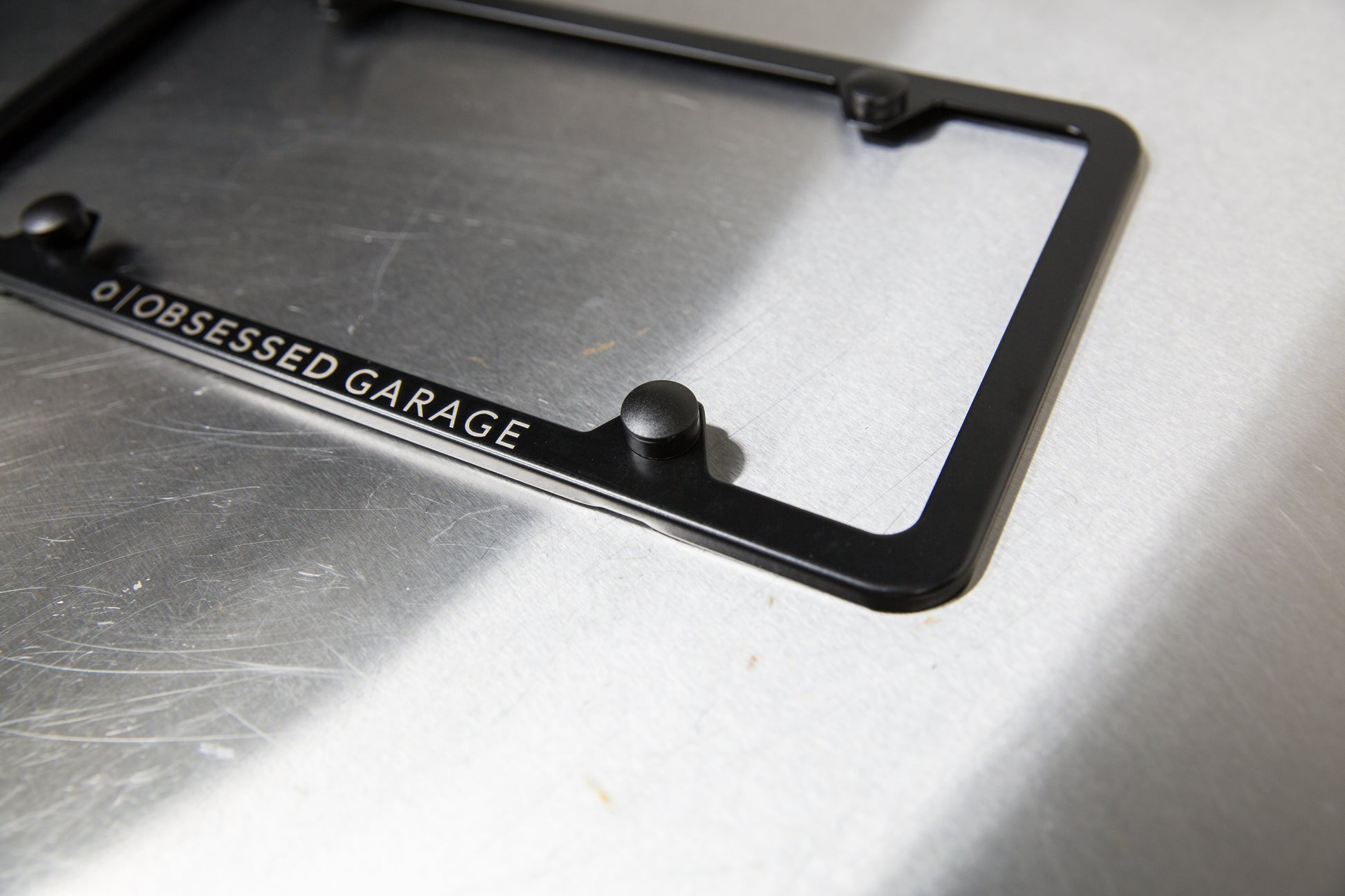 Ford Mustang Logo Black Stainless Steel License Plate Frame made in the Ford Mustang Logo Black Stainless Steel License Plate Frame made in the